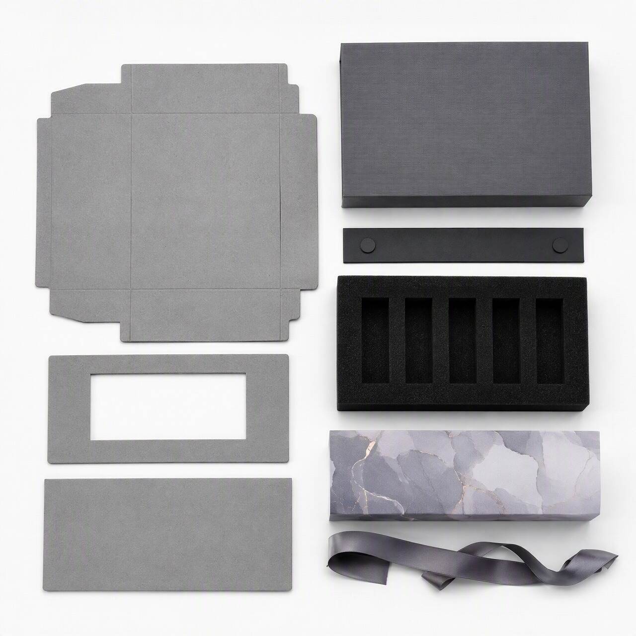 Packaging materials for discovery set perfume boxes including rigid greyboard, foam insert, ribbon and printed sleeve Packaging materials for discovery set perfume boxes including rigid greyboard, foam insert, ribbon and printed sleeve