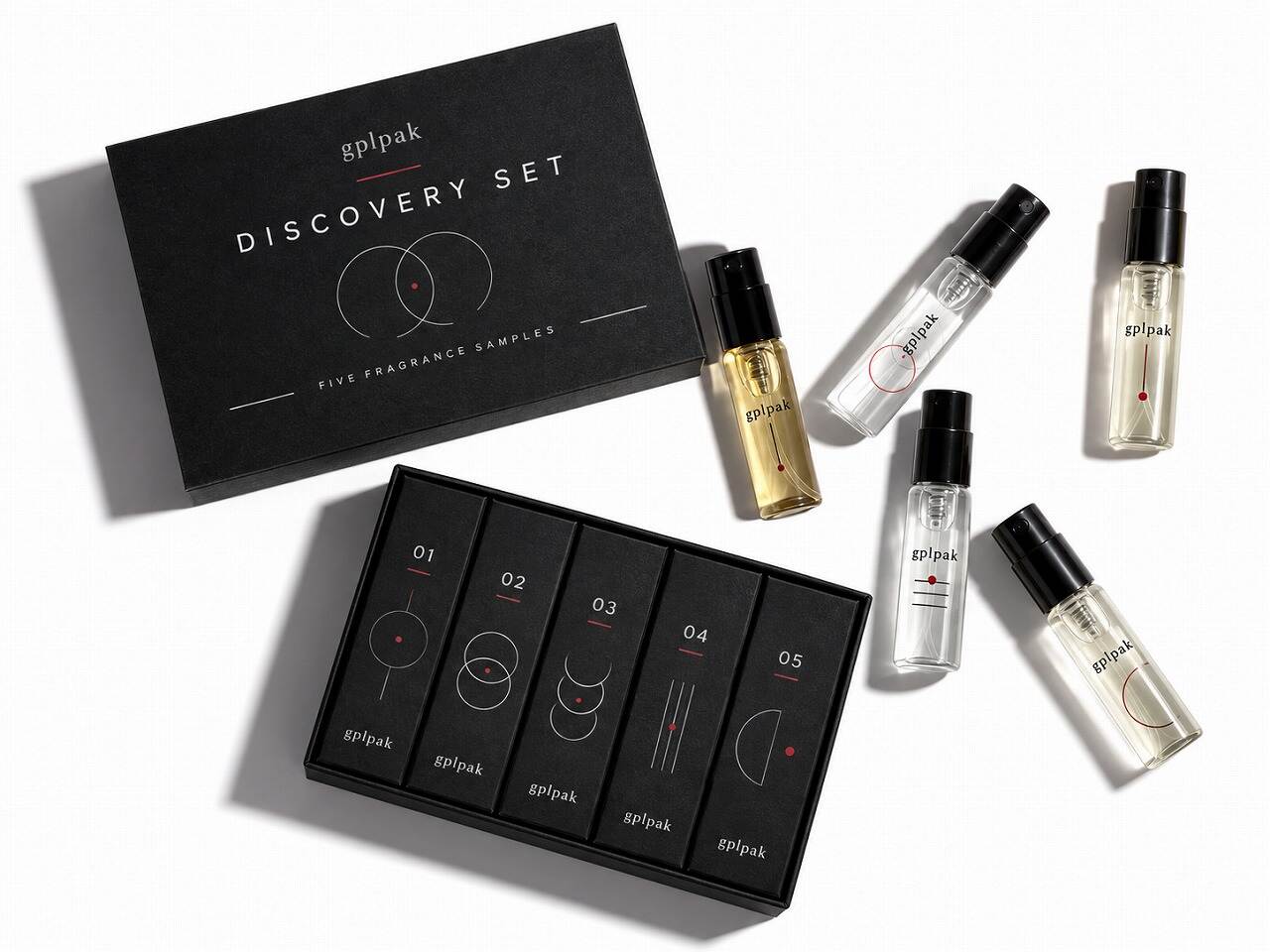 Open rigid discovery set perfume box with custom foam insert holding fragrance sample vials